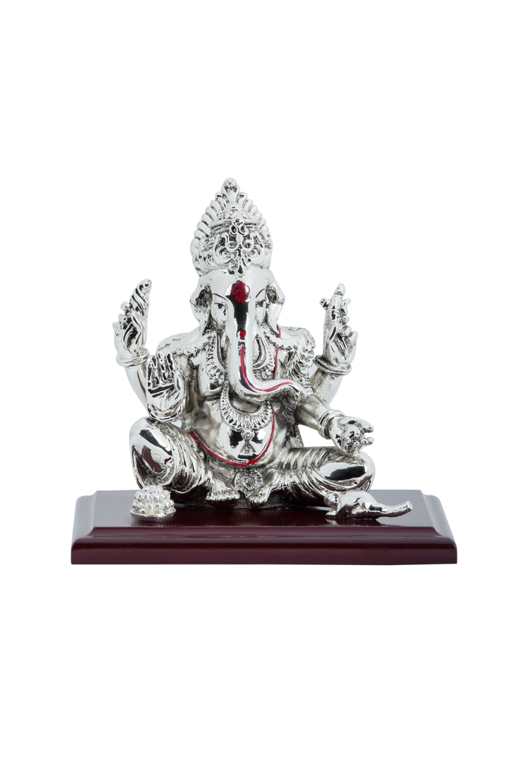 Silver Ganesh ji sitting on wooden stand